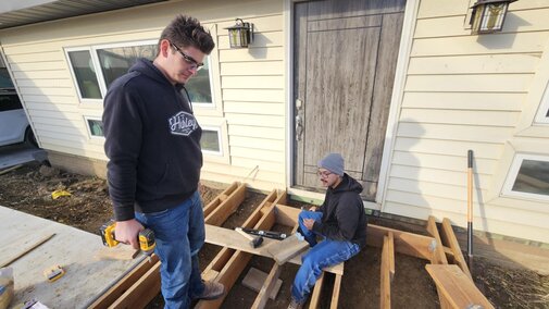 Laying down boards to build front patio Nov 23, 2024